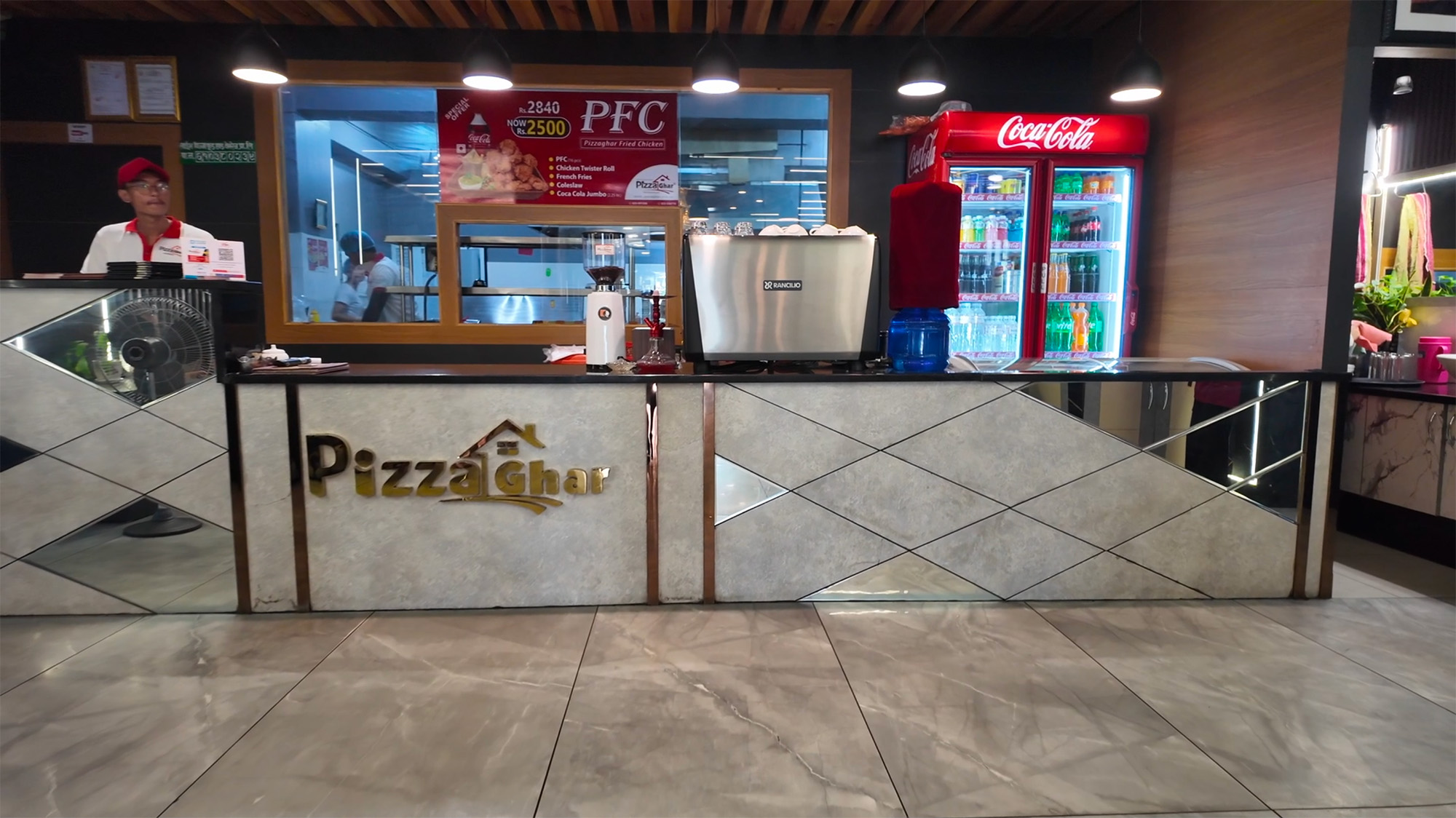 Interior Design of waiting area of cafe in Jhapa designed by Purple Kitchen And Interior of a cafe named Pizza Ghar