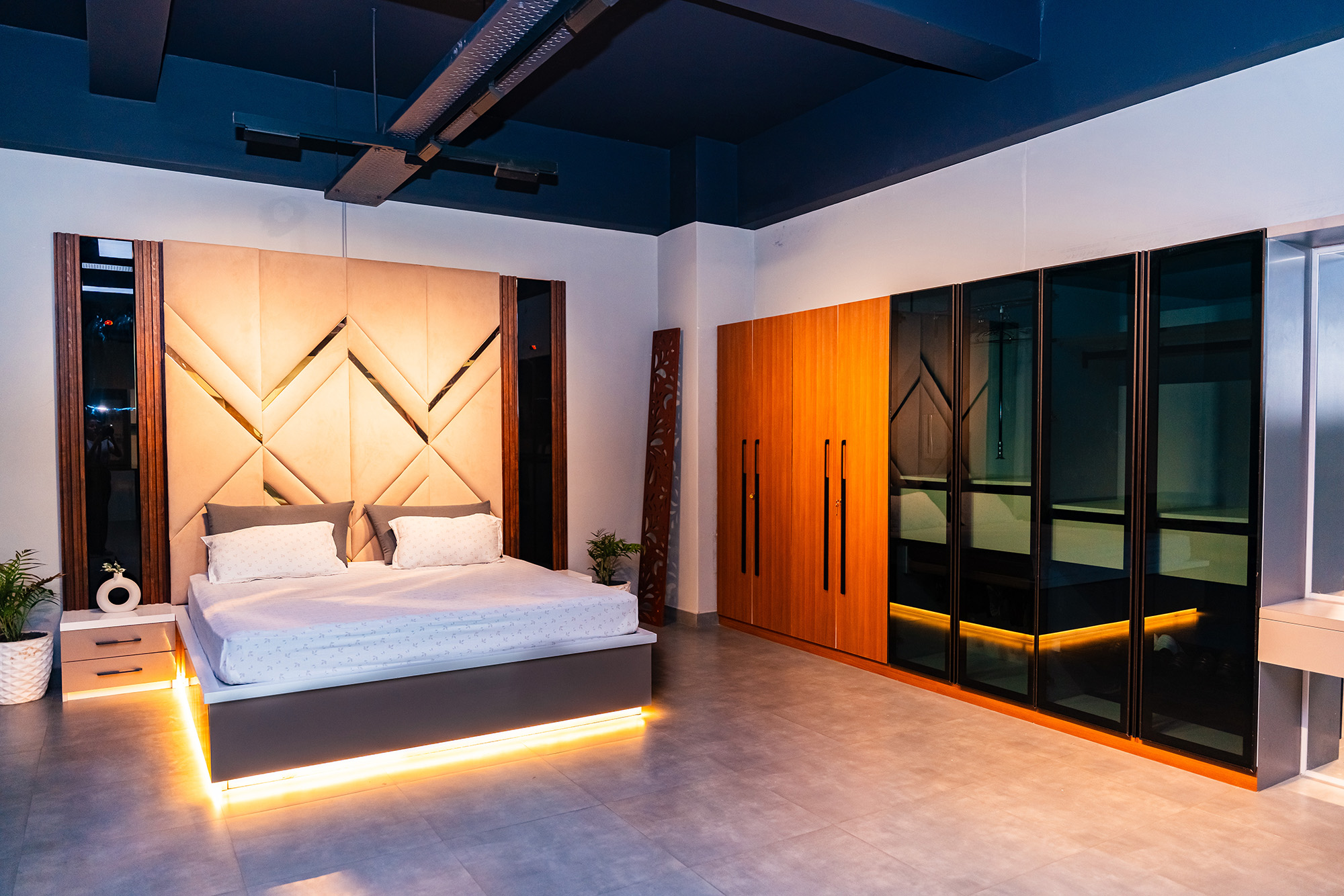 Sophisticated and stylish bedroom interior design with modern appliances, designed by Purple Kitchen And Interior