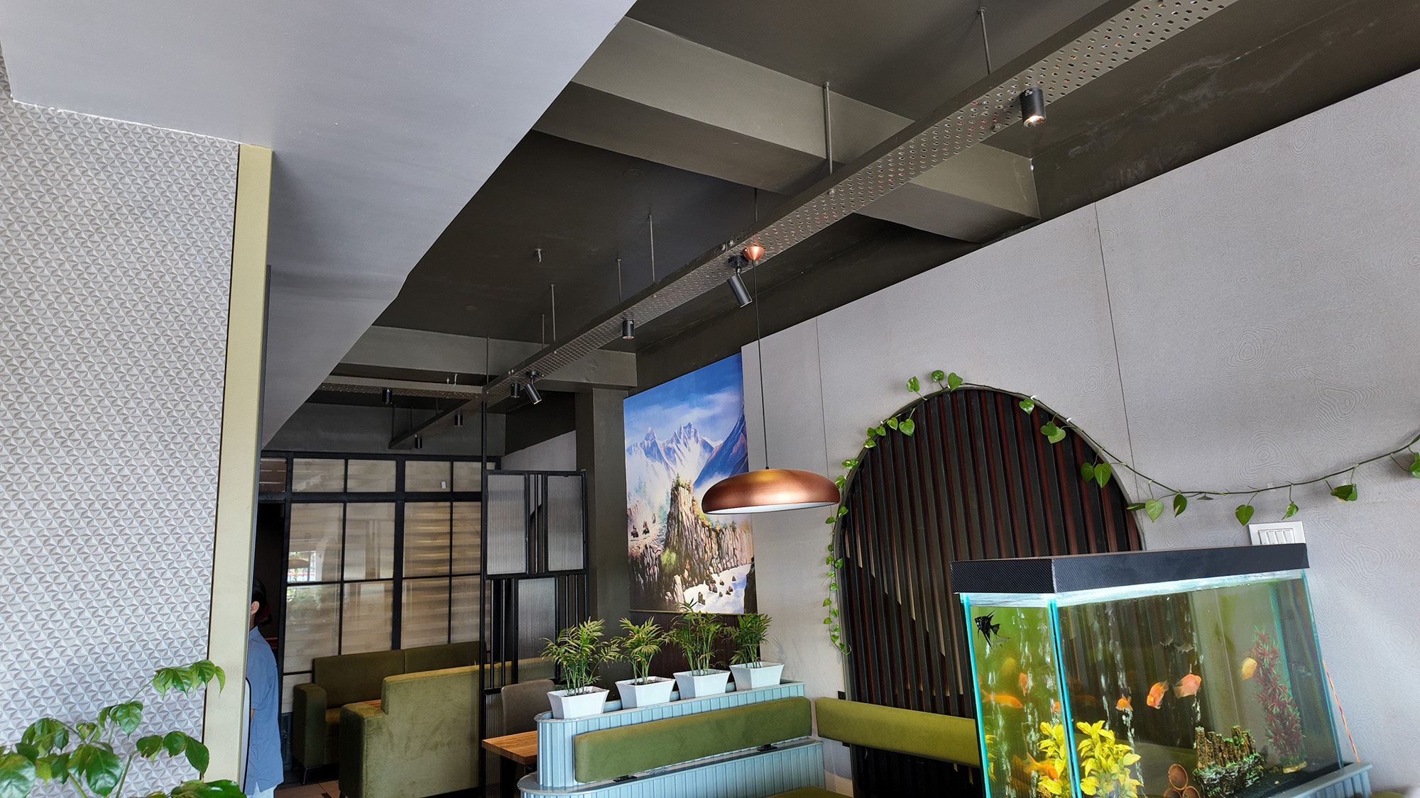 Interior design in Jhapa with modern lighting and decor elements for a cafe named Lungma designed by Purple Kitchen And Interior