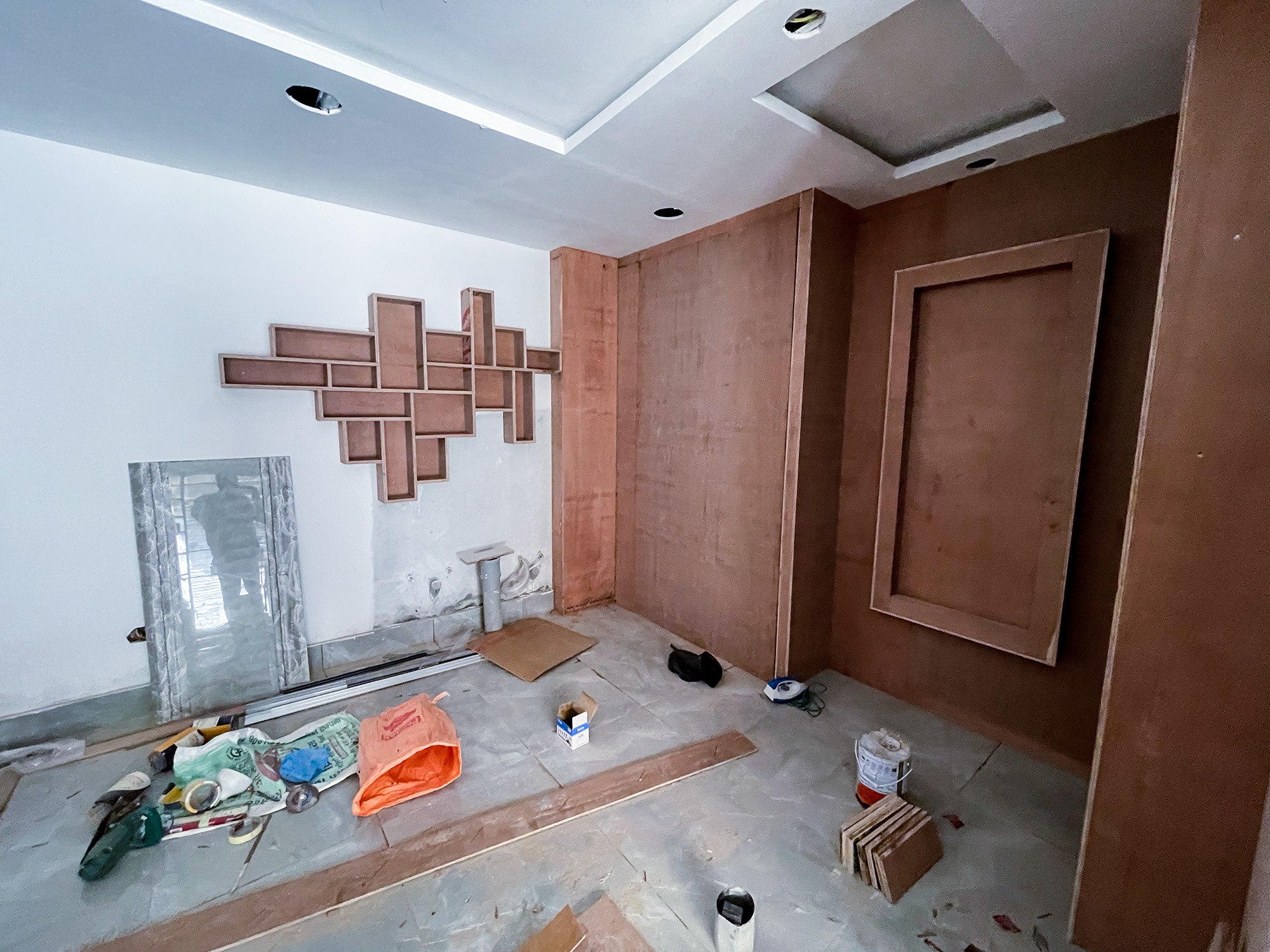 Construction of sitting are of grand saloon by Purple Kitchen And Interior
