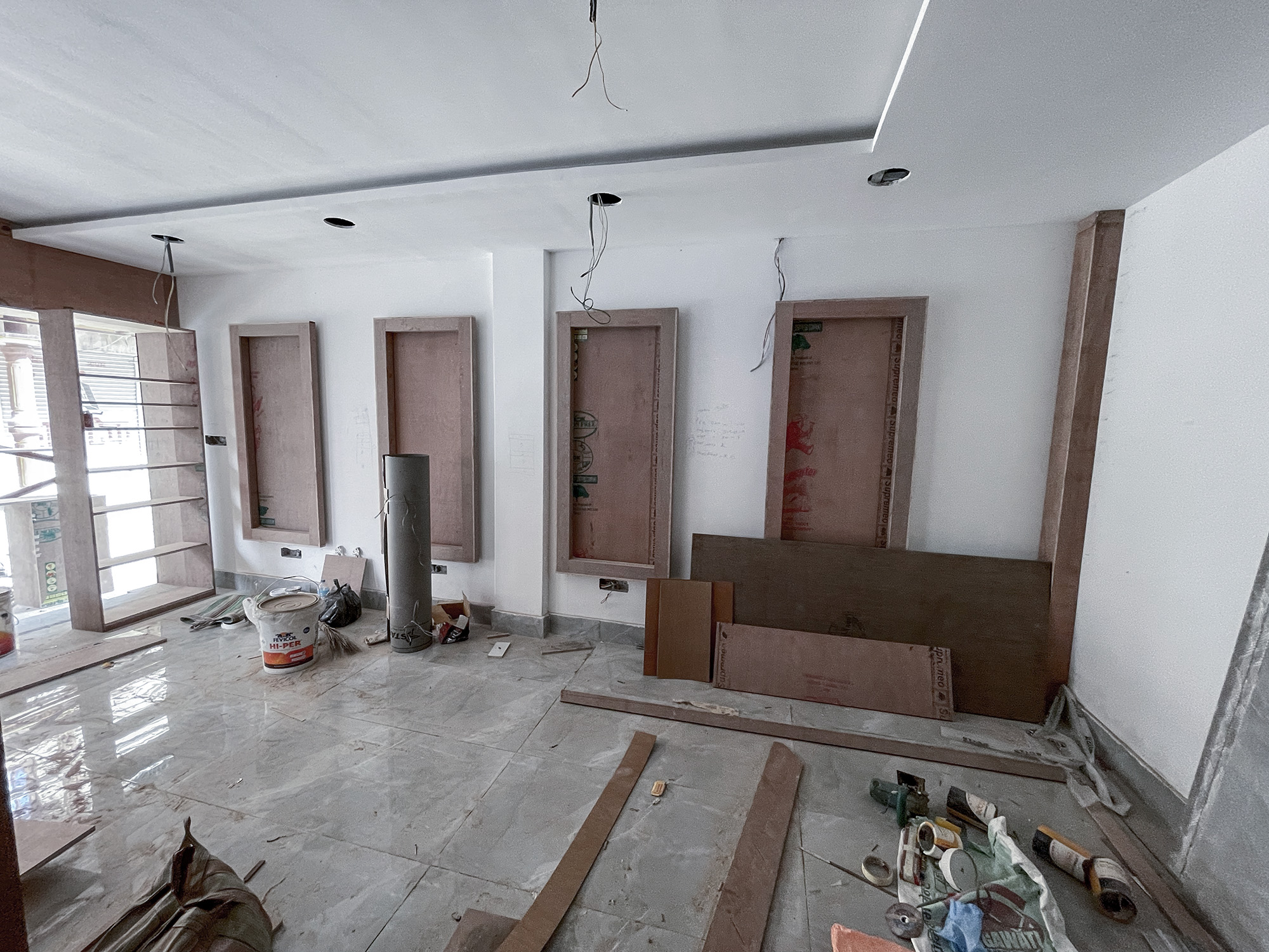 Construction of grand saloon by Purple Kitchen And Interior